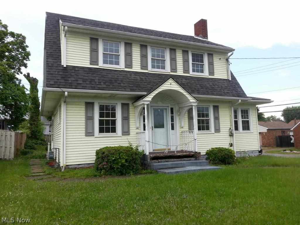 Spacious 3 BR home with large LR, formal dining, den/office on main level, rear deck off kitchen, and detached garage.
