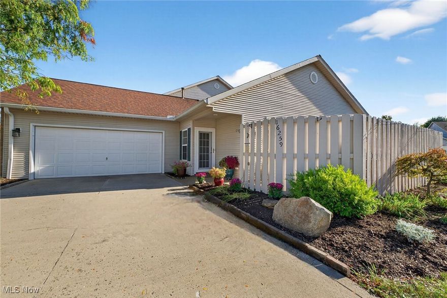 Beautiful ranch offers inviting great room with vaulted ceilings and gas fireplace with wood mantle and tile surround. Spacious kitchen features granite countertops and stainless steel range, refrigerator and microwave. Convenient breakfast bar is ideal for casual meals, with an adjacent formal dining area for gatherings. Primary bath has new walk-in shower with fold-down seating for comfort. Glass doors lead from the great room to your private patio with natural gas hookup. Enjoy this cozy space to relax or entertain family and friends! Laundry room with utility tub and wall cabinets. Attached garage has built-in storage cabinets, work bench, water supply and attic access. Durable nature stone flooring complements the garage, patio and walkway. Colorful landscaping accents the yard, while the association provides lawn maintenance and snow removal. Nearby Metroparks, Wallace Lake, Baldwin Wallace University, schools, restaurants and major freeways. Welcome home!