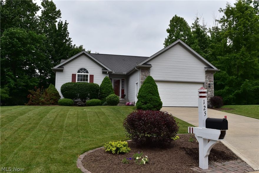 ONE FLOOR LIVING IN WOODS OF BURLINGTON! Immaculate 3 Bedroom & 2 Bath Ranch with desirable open concept floor plan & vaulted ceilings throughout. Foyer with ceramic floors open to Dining & Great Room combination with stone gas fireplace & skylights. Eat-in Kitchen with hardwood floors, all appliances & sliders to spacious deck. 3 vaulted Bedrooms include 1st floor Master Bedroom with walk-in closet. Private Master Bath with double sink vanity, jetted tub, separate shower & ceramic floors. Central air. 1st Floor Laundry Room with access to 2-car attached garage. Several recent updates include: New hot water tank, freshly painted interior in main part of home, some newer windows & appliances. Full Basement has been partially finished and could double your living space. Beautifully landscaped yard with manicured beds and situated on a cul-de-sac, this is one of the nicer lots with wooded backyard for added privacy. Community offers walking trails, playground, pavilion and just minutes to