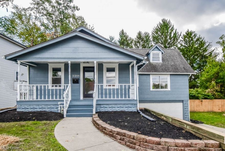 Nicely updated Cape Cod in a convenient Ellet location, just across from Windemere Elementary! Charming curb appeal and an inviting front porch welcome you into the living room with new vinyl plank flooring that extends throughout the home. The dining room sits between the living area and a stunning new kitchen with a tiled backsplash, white cabinetry, and stainless steel appliances. One-floor living is possible with two main-level bedrooms and two full baths. The master enjoys a private full bath with a tub and tiled shower, while the main full bath is equally impressive. Upstairs, you'll find two more bedrooms, one that would be ideal for a home office. Outdoors, you'll appreciate the rear deck with a wooded view, a large side yard, and an extended driveway leading to the built-in two-car garage. Recent improvements include all-new flooring, paint, lighting, the kitchen, bathrooms, water heater, and an upgraded electric panel. Don't miss out – call to see this home today!