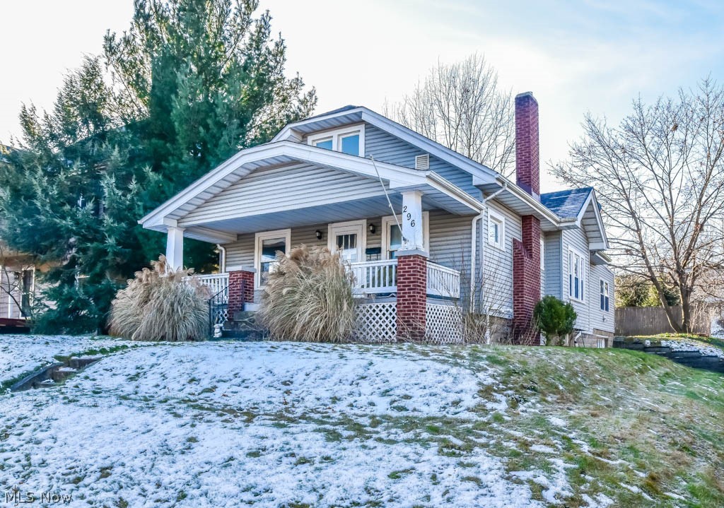 This beautiful Cape Cod has tons of charm with modern updates throughout. It is right across from Firestone Park - a wooded park with walking trail, playground, tennis courts, picnic pavilion, little league field, and community center. It is centrally located with easy access to 77, 76 and 224. A welcoming front porch opens into a living room complete with hardwood floors, crown molding and a wood burning fireplace. The formal dining room offers the perfect spot for holiday gatherings and includes a built-in window seat with china display and storage. The kitchen is amazing featuring tons of cabinetry and a center island with eating ledge. A spacious dinette and door to the patio are an added bonus. Two nicely sized bedrooms on the main floor share an updated full bath with tub/shower combo. A modern 1st floor laundry completes the main level. Upstairs, you'll find a roomy master suite with a bonus space that could be used as an office or sitting area and a private half bath with