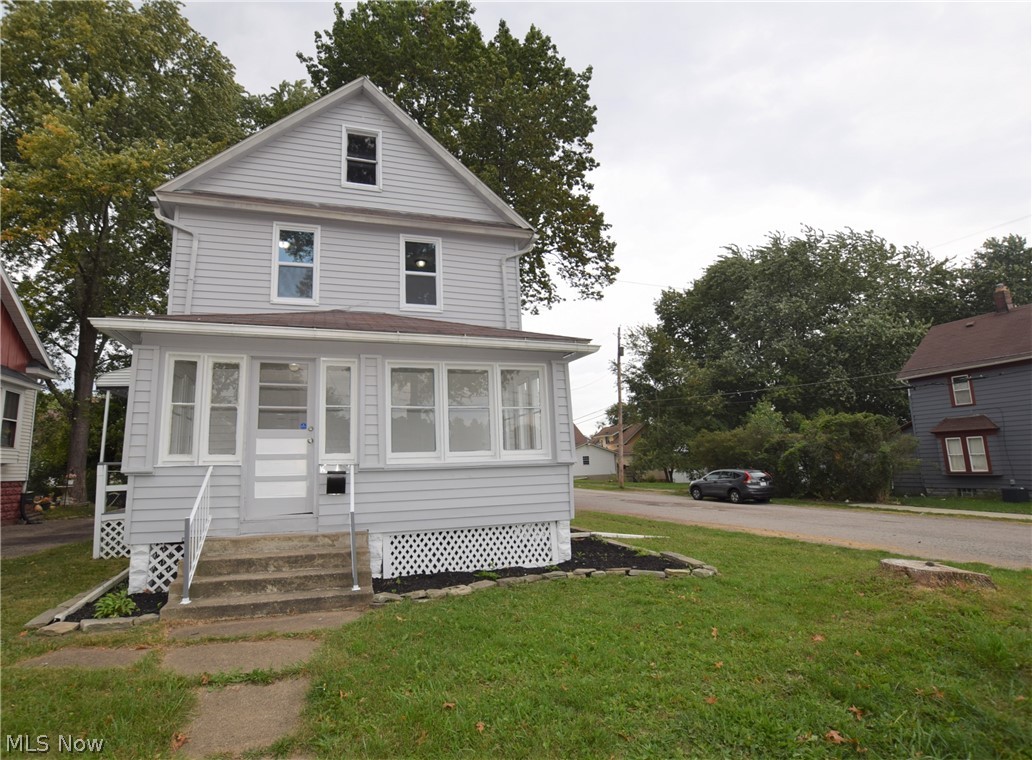 Welcome to 135 Oakwood Street in Barberton! This stunning home has been completely updated inside, out. The entire house has all new flooring and paint. The immaculate kitchen has incredible, modern concrete counter tops, bright white cabinets, tile backsplash, and new lighting fixtures. A convenient full bathroom is located directly off the kitchen. Off the spacious living room, there is a completely enclosed front porch full of windows – the perfect area to relax! Head upstairs to find three bedrooms and a second full bathroom. The bathroom uniquely has a doorway that leads to a large balcony on the back of the house. Underneath the balcony, there is another porch on ground level that leads into the kitchen. The basement walls, ceiling, and floor have all been recently painted – making the basement fresh and clean! This home has two garages as well as a brand new AC unit. Don’t miss your chance to own this incredibly beautiful home!