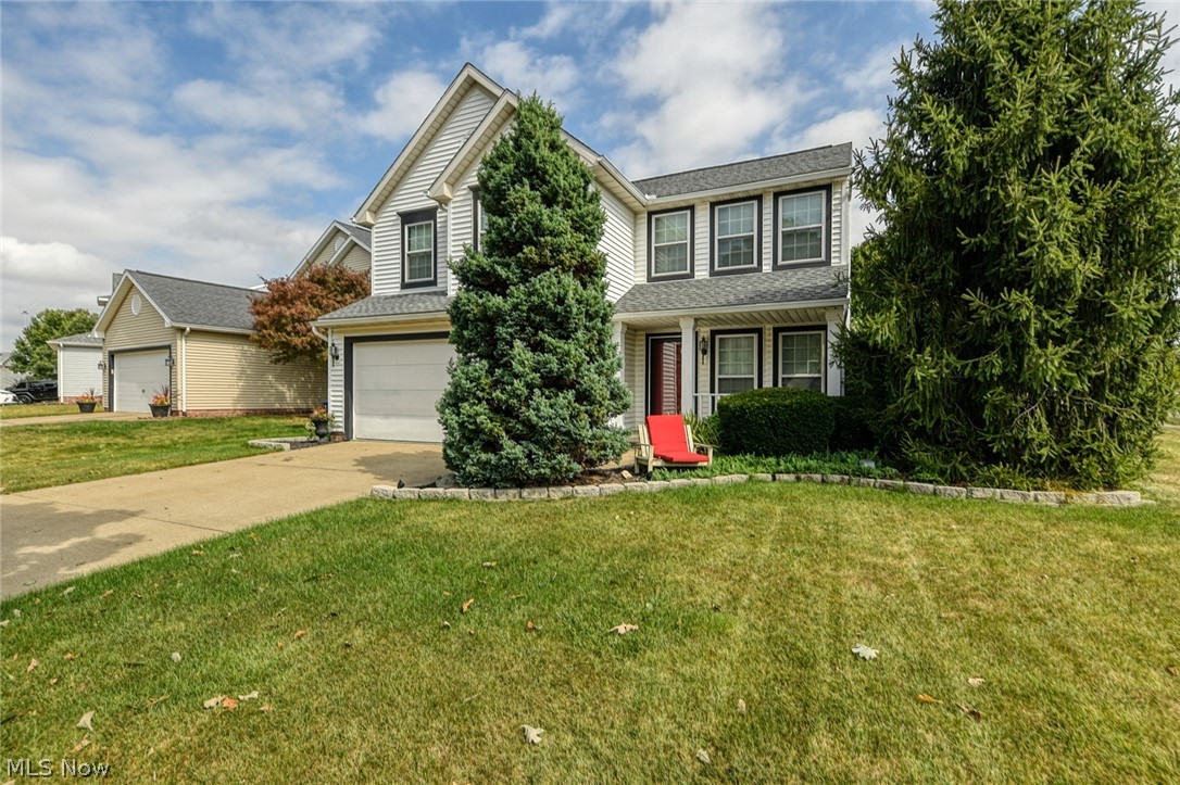 Come check out this MOVE IN READY model home! This immaculately maintained home is on a corner lot with beautiful landscaping! It has a paver patio that is perfect for cookouts and has awesome outdoor lighting. Walk in the front door to a nice open concept floor plan with laminate flooring throughout the entire first level. The living room is a great size and perfect for an oversized couch. In the kitchen you will immediately notice the gorgeous granite countertops! The kitchen has an updated backsplash, beautiful soft close white cabinets, stainless steel appliances that includes a 5 burner gas range! In the kitchen, there is a nice pantry as well as a spot to add a bar top table. The 2 story dining room is absolutely stunning and is the perfect spot for entertaining! It provides lots of natural light, access to the patio and has a fireplace. Head upstairs to 4 bedrooms, 2 full bathrooms and second floor laundry! The 3 bedrooms are all great sized rooms, neutral color paint and each