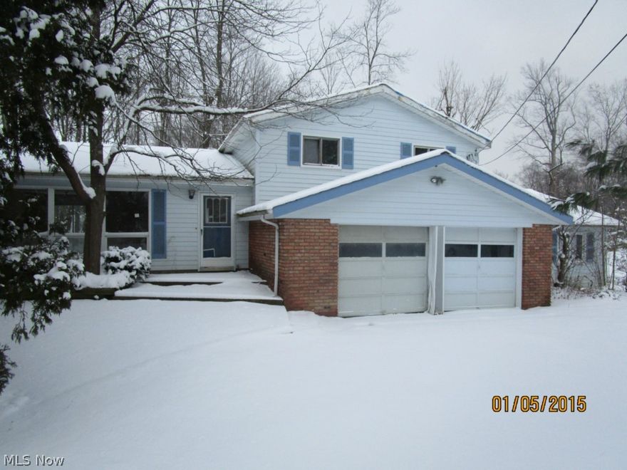 Spread out in this rambling split level in Chesterland. Featuring 4 bedrooms, 2 full baths in 1768 sq.ft. of living space. Unique floor plan. Formal living room with wood flooring and large picture window. Formal dining room with glass sliders to back yard patio. Open kitchen is light & bright with tiled floor and opens to another dining area with glass sliders to another back patio. Huge family room with unique brick fireplace and hearth. Main level bedroom could be used as a guest room or home office. Spacious bedrooms upstairs with large full bath. Needs some TLC and this will be your forever home! Employees and family members residing with employees of JP Morgan Chase Bank, N.A., its affiliates or subsidiaries are strictly prohibited from directly or indirectly purchasing any property owned by JP Morgan Chase Bank, N.A. All offers must be submitted with pre-approval letter or proof of funds.