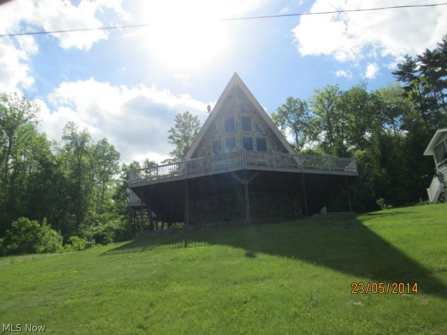 Well maintained 3 bedroom, 3 bath A-frame with a fantastic view of Seneca Lake. Home has amazing front windows to the ceiling and a magificent wrap-around porch. This property is sold as fee simple and selling "as is".