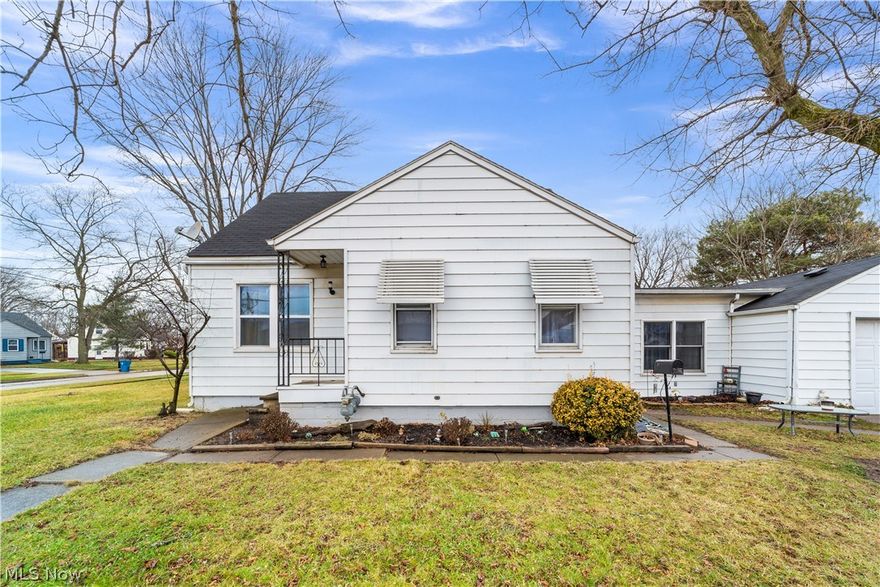 This lovely 3 bed, 1.5 bath home is nestled on a lush corner lot just minutes from Lake Erie and Lorain’s Cromwell Park is spread out with seamless entertainment through the main living space. This main living space boasts a wonderful front facing living room, galley style kitchen, and a spacious family room with newer sliding glass doors to the fenced in backyard and access to the attached 1-car garage. Newer flooring has been added in both the living room and family room. The eat-in kitchen features wood cabinetry, vinyl flooring, and a dedicated dining area to enjoy your daily meals. Both first floor bedrooms are placed around the corner with a wonderfully updated bathroom between. Up the stairs you will find a large and vaulted master bedroom with original custom built-ins or utilize this space as additional entertainment or office. Enjoy the endless potential in the partial finished basement with additional room for storage and a convenient laundry room with toilet and utility sin