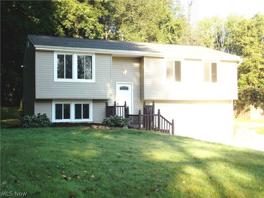 New, Remodeled, Fresh and Clean with 1400 sq ft of living space.  4th bedroom or Rec Room with a new half bath.  Remodeled kitchen with appliances.  New bathrooms, new carpet and wood flooring.  New roof and siding.  New concrete driveway and rear deck.  New furnace and AC.  Open floor plan with kitchen island bar.  First floor laundry. Many updates and ready to move in.  2 car attached garage with openers.  All brand new satin nickel decor and fixtures.  Neutral paint, flooring and carpet.  Tiled foyer and bathrooms.  New landscaping and much more.  Nicely sized lot on the street and with private surrounding woods.  Beautiful home with much to offer.  Move right in!