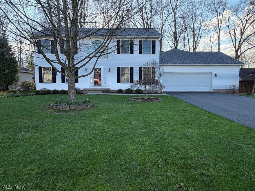 In a quiet tucked away neighborhood in Cortland, Ohio awaits a beautiful 2,924 sq ft classic colonial.  A welcoming foyer greets you as the front door opens to this spacious house.  The open floor plan with an eat-in kitchen w/island and family room with adjacent dining room is great for entertaining and keeping your family and friends close.  The kitchen area has an enormous amount of storage.  Extend your entertaining outdoors to the deck right outside the sliding door. If you prefer a moment to yourself, then head over to the living room space and cozy up with a book or catch up on your social media.  Upstairs you are greeted with a large sitting area.  There is a  primary bedroom with ensuite bath and large 10 x 6 walk-in closet, two large bedrooms and a bathroom are also located on the second floor. The private in-law suite is located down a hallway off of the kitchen on the first floor. WOW, the in-law suite empresses in the first room with tall ceilings, large windows, eating area, sitting area and kitchenette. The bedroom has plenty of space plus a huge walk-in closet. There is a full bathroom with a seated walk-in shower. It also has its own access to the deck off of the back of the house. The attached oversized two car garage is heated and offers storage space.  The house is all set up for a portable generator (connection outlet is in the garage).  The basement is an open slate for you and your needs.  Call today for a showing!