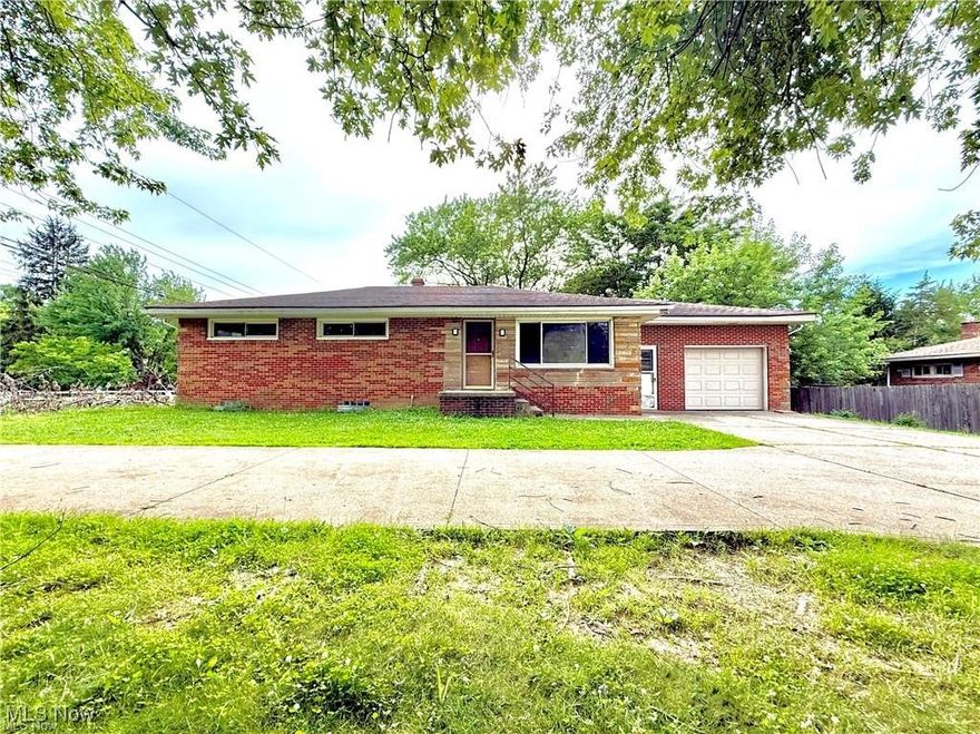 Priced for a quick sale!!!!! Welcome to 3241 St Rt 43, Mogadore located within Brimfield Township. A charming brick ranch with a one-car attached garage featuring 1,161 sqft with 3 bedrooms and 1 full bathroom on a .43 acre lot. Inside, you'll find a spacious living area with a dinette that opens to the covered back patio, kitchen with appliances. Original hardwood floors run through the hallway and 3 well-sized bedrooms, ready to be refinished to your taste. The bathroom has a double-sink vanity. AC/Furnace & Well Pump (2020). Water Softener and Vinyl windows throughout and the full-sized basement is waterproofed offering ample storage and great potential for finishing. The property includes a convenient side-street entry driveway off of Sunview Drive and connects to the access off of St. Rt 43 providing easier access + extra parking + a turn-a-round. Immediate possession upon closing. Ideal investment -- don't wait!