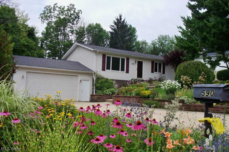 Picturesque, well maintained Raised Ranch.  Hardwood floors throughout.  Both living room with large picture window and dining room with bayed window over look amazing park like front and backyards with many perennials!  Eat-in kitchen with tile ceramic floor.  Relax and enjoy the enclosed sun room with ceiling fan and Knotty pine paneling.  Spacious low4er level family room and glass block windows.  Two car attached garage and an additional 3rd garage with gas heater.  Furnace 1 year; H2O tank 3/15, washer and dryer included.