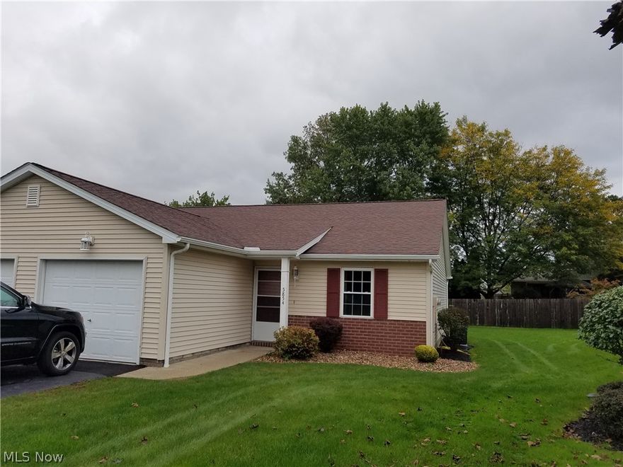 NO STEPS! ATTACHED GARAGE WITH GENI,  MOVE IN READY CONDO! Stunning, RENOVATED! All new paint, remodeled Kitchen with white cabinetry, new hardware, new counters, new double stainless steel sinks, new faucet, new flooring, Electric stove & hood all opened to the Great room with huge custom Bar style counter! Never feel disconnected while cooking, cleaning even laundry, New fresh inviting space now. Swinging doors to adorable & fully functioning Laundry room with white cabinets, & washer & dryer stay! Remodeled Bath. New floors & solid wood trim. Built in dishwasher. New light fixtures & updated electric & new switch covers. Beautiful private deck, just repainted, tranquil view of grass & privacy fence, flower beds, off Great room new, hi style sliding glass doors. sealed blacktop double driveway. Bedrooms are good size, ALL new flooring, fresh paint, new closet doors & new vinyl windows. Master has lighted walk in closet, the other one has a fantastic closet organizing system New GFA/C