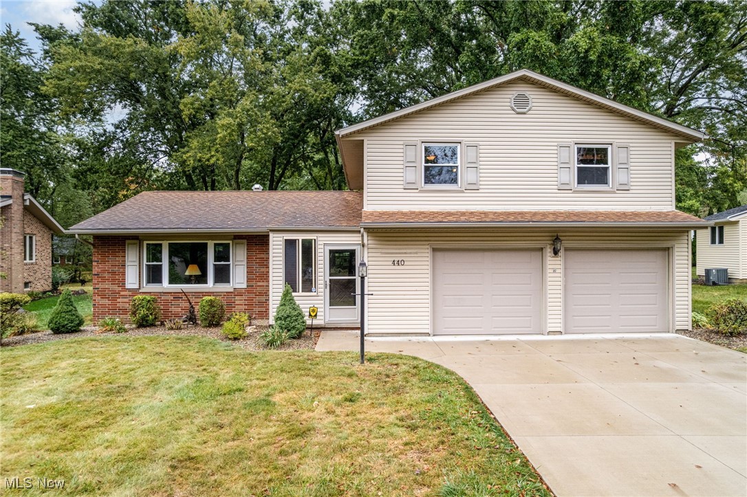 Welcome to this well-maintained 3-bedroom, 2.5-bath split-level home in Wadsworth. Set on one of the largest lots in the neighborhood, the property features a stunning, canopy-like setting that offers both shade and privacy. Inside, you will find a formal dining room, a bright living room with a large picture window, and a comfortable family room complete with a cozy fireplace and built-in shelves. The master bedroom includes an attached bath and generous closet space, while the finished basement provides additional living space with a rec room and bar—ideal for entertaining. Step outside to enjoy the peaceful backyard from the patio, and take advantage of the heated 2-car attached garage. A brand new double driveway add to the home's curb appeal and everyday convenience. This well-cared for home is ready for it's next chapter - schedule your private showing today!