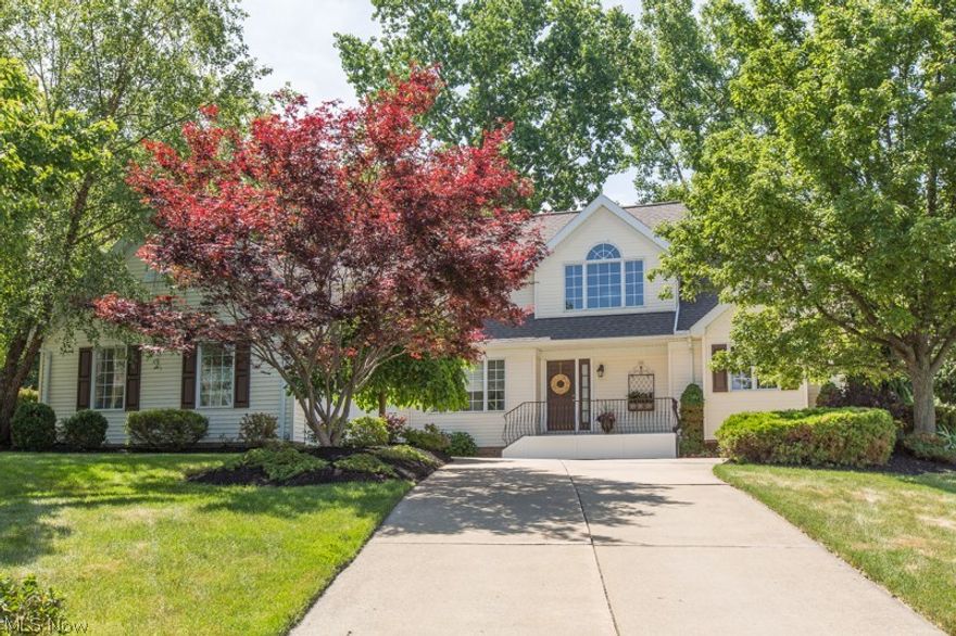 As you drive up to the architect-designed house, admire the professionally landscaped property developed by Metro Parks designer. Walk indoors to a vaulted great room with WB fireplace, built ins, and an open walk way above. Proceed to the vaulted sunroom surrounded by a English-style, terraced garden that provides the ultimate in privacy, whether in the sunroom or on the patio. First floor master suite has California organized walk in closet, vaulted master bath with designer tile floor and tiled shower, jetted tub, dual vanity, and solid surface counters. Eat in kitchen features granite countertops, tile backsplash, stainless steel appliances, wood floor and view of garden and level yard perfect for bocce ball or play set. Formal dining room includes trey ceiling and chair rail. first floor laundry located near 2 car att garage finished with ultimate overlay floor. Second floor has two generously sized bedrooms, bedroom #2 with walk in cedar closet, bedroom #3 with 11x6 walk in close