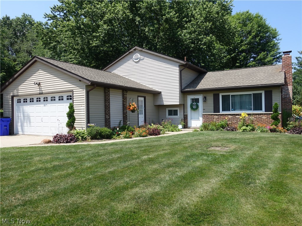 Super nice and updated 3 level split! The living room is vaulted, has a contemporary flair and offers a wood burner. The stylish, updated kitchen offers granite counters and custom maple cabinets with spice cabinet. All lower cabinets are sliders. LG fridge and custom dishwasher. Cork floors in kitchen and Pella kitchen slider. Three bedrooms with nice closet space and updated full bath complete the second floor. The family room is a great size and there's a convenient updated powder room. The laundry area has enough space for a large office. The slider off kitchen leads you to an awesome patio and nice, flat backyard. Nice 2 car garage with extra storage. Updates include: Custom kitchen including appliances - 4 years; Roof, Patio & extra 3rd driveway (for your RV/Camper or extra vehicle) - 5 years; Windows - 6 years; AC, heat pump & hot water tank - 7 years. Nothing to do but move in and enjoy! Home Warranty is offered to the buyer for peace of mind.