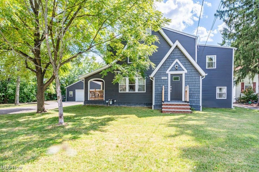 This home has charm and character which is evident as you walk in the front door. This home has been updated with keeping the charm of some of the original features. As you enter the side door from the porch you see how large the living room is with Fireplace and refinished hardwood floors which are throughout the first floor. The dining room with build in corner cupboard that leads into a totally updated kitchen featuring updated appliances; stove w/pot filler for convenience and lots of trendy cement counter space making it a chef's dream.  The spacious family room off the kitchen features French doors that lead to the back yard, and an updated 1/2 bath complete the first floor.  The 2nd floor features spacious rooms with the master bedroom with build in shelves.  A remolded full bath with marble floors features both a tub plus separate shower and cabinet.  Three additional spacious bedrooms with refinished hardwood flooring.  The LL has room for storage and has the laundry hookups.  The outside has a lot to offer with covered side porch which gives you a great space to enjoy your morning coffee as weather would allow.  The property has a large oversized 2 car garage with a large, covered patio that would make a great area for outdoor entertaining.  Updates in 2020 include roof, vinyl siding on home and garage, new windows and furnace, central air and hotwater tank 2024.  Call today to come out and take a closer look at this charming property.