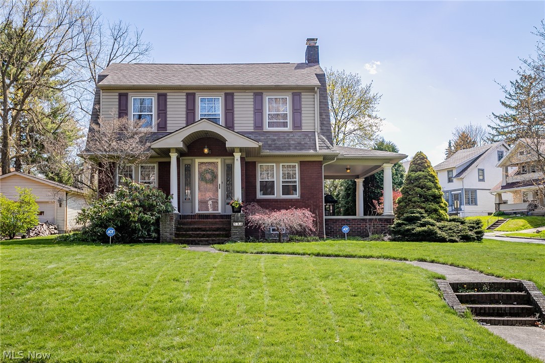 Welcome to this incredible Firestone Park Colonial! The home boast over 2300 square feet with endless character and charm. Beautiful natural woodwork with eight inch baseboards, crown molding, and refinished hardwood floors are throughout the home. The spacious living room is centered around the impressive wood buring fireplace. Off of the living room, through the curved arch way, is the dining room, perfect for hosting. The kitchen was updated with beautiful hickory cabinets, tile floors and back splash, granite counter tops, and newer appliances. Into the nicely sized family room with built in cabinetry and updated laminent flooring and paint. The family room has large, bright sliding glass doors leading to a private paver patio and side porch over looking the yard and flower beds. Up stairs, the Master suite has vaulted ceilings, updated laminent flooring and paint, with an en suite master bath and two large closets. The three other bedrooms all have generous space for kids, guests,