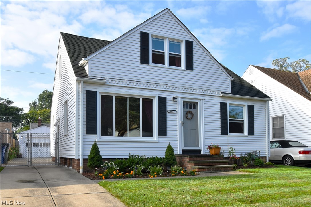 Charming VIBES abound in this adorable updated Brooklyn bungalow. Nothing for you to do but pack! Landscaping is on-point. Updated vinyl siding and windows. Gleaming Harwood floors! Spacious bright living room flows into the kitchen featuring unique ceiling detail and newer stainless appliances, plus tons of lighting! Reverse osmosis water filtration system stays. Kitchen open to your dining room through new French doors, currently being used as a sunroom/ entertainment space. Large closets. Natural light everywhere, with a perfect view into your beautifully landscaped backyard featuring new stamped concrete patio. Modern stylish Full bath on the first floor that has recently been updated. Two bedrooms, both a nice size, also on the first floor. Central AC. Third bedroom upstairs with large landing area and tons of storage space. The basement is partially finished with a rec room along with a a workshop area, a half bath, and laundry area. 1.5 car garage and yard is fully fenced in. Ch
