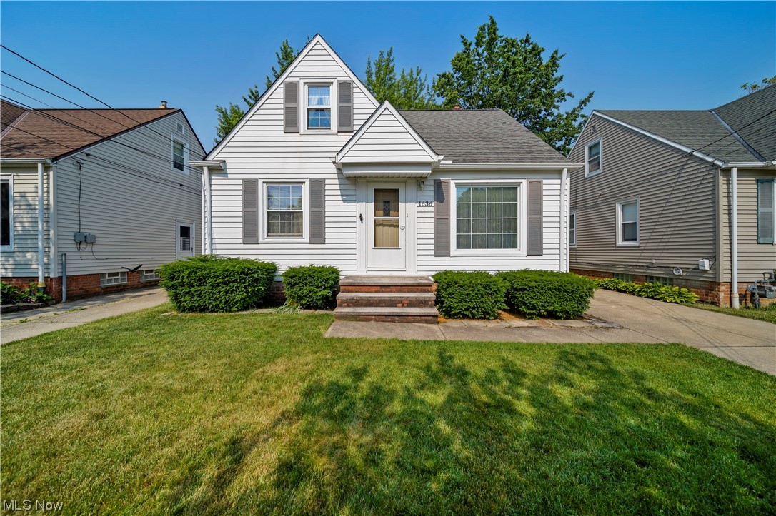 PRIDE OF OWNERSHIP SHOWS throughout this well-maintained bungalow home offering 3 bedrooms/2 full baths, first floor family room with gas fireplace, a partially finished basement, and a 1+ car garage with built in storage. The hardwood floors throughout the first floor have been refinished. The addition of the first floor family room with a gas fireplace and a large picture window overlooking the backyard also has space for formal dining. The eat-in kitchen was remodeled: cabinetry, countertops, flooring, lighting and appliances (double oven, dishwasher and refrigerator all stay). Vinyl windows were added in all rooms with the exception of the first floor family room. The lower level has a rec room, newer full bath, and plenty of storage. Electrical box and the gas hot water tank are newer. The gas furnace has been replaced and maintained regularly. Central air was added. Washer, dryer and basement refrigerator stay. Seller is providing a one-year home warranty. Convenient to f