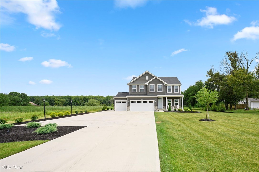 A unique opportunity to own a FULLY FURNISHED home, beautifully accessorized and designed by designers, never lived in - was used as a builder's model home for a short time - includes a 3 car garage, is located on over 3.19 of acre property, has city water and city sewer, is filled with over $126,000 in UPGRADES, and is professionally landscaped with a sprinkler system. This spacious home offers open living space, with 3 bedrooms on the second level, a versatile 2nd-floor loft, a 1st-floor office with French doors, and a separate 1st floor BONUS room/4th bedroom. An upgraded eat-in kitchen features a large center island, quartz countertops, tile backsplash, soft-close cabinetry, undercabinet lighting, and all stainless steel appliances, all overlooking a dining area with access to a covered deck and a sun-filled family room. The owner’s suite includes two walk-in closets and an en-suite bath with double vanity and tiled Roman shower. A guest bedroom also includes a walk-in closet. Additional features include a walk-in pantry, mudroom with built-in storage bench, 2nd-floor laundry, and with abundant recessed lighting. A full basement offers even more potential for future expansion if needed. A covered front porch and extra long driveway with extra parking and exterior lights round out this one-of-a-kind home. A complete list of upgrades is available upon request. INCLUDED are: ALL furniture and decor currently in the home, ALL kitchen appliances, washer/dryer, window treatments and transferable builder warranties. Conveniently located near I-71, I-76, OH-18, Medina's Public Square, shopping, restaurants, parks, golf courses, and so many other local attractions.