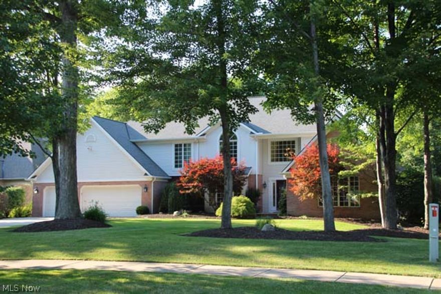 Are you looking for an exceptional home in the Solon school district? STOP! Here it is!!  This gorgeous 5 bedroom home has every bell and whistle you can imagine. A grand foyer with custom wrought iron railing greets you at the door. There is a formal, vaulted living room w/ a huge palladium window, a library, a music room, and a stunning great room adjoining the updated granite kitchen,w/ huge island. A formal dining room, 1st floor laundry and two half baths complete the first floor. Upstairs are five large bedrooms w/ three full baths. The master overlooks the lush back yard (more on that later) and has a glamour bath, plus huge walk in closet.  All bedrooms have large closets space and big and bright windows. Looking for more wow? The amazing lower level will seal the deal. There is a full bath, an exercise room,a large open game area....AND a custom theater room, complete with 105"screen and stadium leather seating. The back yard will continue to impress, a perfect pool, with a hot tub, large deck area,out door speakers and gorgeous views of nature. This home has designer lighting through out and has been meticulously maintained by its current owner. With over 4100 square feet,this is a Spectacular Solon address!