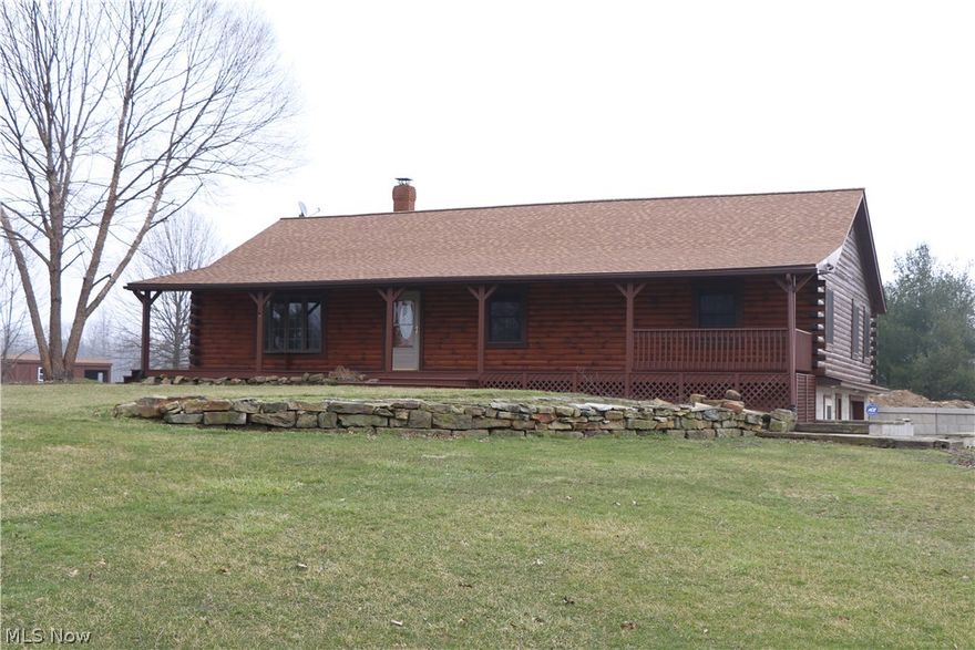 Welcome to this beautiful  log home that sits on 43 picturesque acres. Enjoy the privacy of the land, but also the ability to rent out the land for farming. A beautiful 3 bedroom 2 1/2 bathroom log cabin set over a 1,000 feet off the road, so you can enjoy your privacy. The custom sidewalk leadsd onto the perfect porch to watch the sun set. When you enter the living room you immediately see the craftsmanship and love that went into building this home with hardwood floors and a breathtaking fireplace, that is perfect for keeping cozy. This amazing home features an updated and modern kitchen with a rustic feel. There is a beautiful staircase that leads to a loft that overlooks both the kitchen and living room. There are 3 spacious bedrooms. The master bedroom has a walk-in closet and the large master bathroom with heated tile floors. Walk-out basement has kitchen and full bath and the potential is unlimited for potential finished square footage. Updates include New furnace 2016, masonry