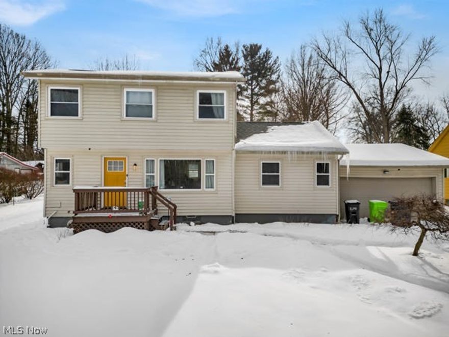 Updated Tallmadge ranch on nearly a half-acre with a first-floor master and first-floor laundry, featuring a full kitchen renovation in 2023 with new dishwasher and microwave, plumbing updates, and all-new plank flooring and carpet 2023, plus updated furnace, AC, electric hot water tank, holding tank; electrical panel and lighting upgraded in 2024; a $4k+ Kinetico water system installed in 2023; a new $3k 10x12 shed 2024; fresh interior paint from ceiling to basement 2023; basement and crawlspace encapsulation with waterproofing in 2024 backed by a service warranty; whole home dehumidifier in 2024, new garage door opener in 2024, gutter guards added in 2024. A huge deck, large yard, and easy access to I-76 add to the appeal, while the layout includes a first-floor master and laundry for convenient single-story living.