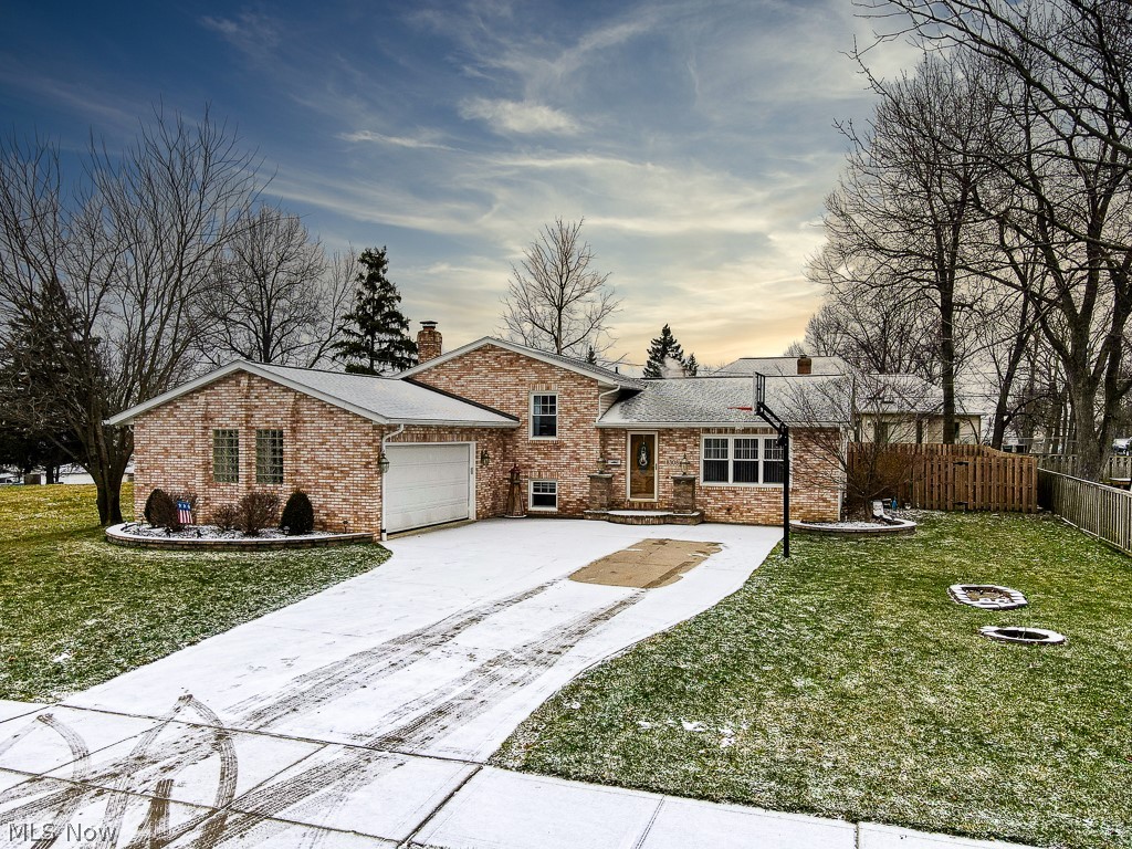 Welcome home to this beautiful brick 4-level split level home! Turn key and waiting for it’s new owner. Open layout as soon as you walk in the door with the vaulted ceilings in the living room and dining room. Stainless steel appliances remain. Walk out the sliding door to the huge wood deck and fully fenced in backyard, perfect for entertaining. Upstairs are 3 bedrooms with both full hallway bath and attached master bath en-suite. Downstairs, the family room is beautifully appointed with marble wood burning fireplace and attached 2 car garage. Through the French doors is where the party starts. Enter the bar area or optional 4th bedroom. The bottom level has nature stone, Owen’s Corning Wall System installed in 2006, a pool table which can stay, and the laundry room. Other updates include: Roof (2020), Gutters (2020), Sliding glass door (2020), Hot water tank (2019), and Full privacy fence (2018). Hurry, this one won't last! Scheduled your tour today!