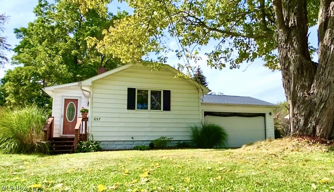 The shores of Lake Erie are just a half-mile from this charming bungalow! This home offers one floor living with main floor laundry, spacious bathroom and bedroom. The eat-in kitchen has loads of storage and features quality handmade cabinets. The large 529 sqft 2-car attached garage is heated with insulated walls, painted floors and a garage door screen to extend the living space. The entertaining space continues out to the backyard where you will find a paver patio, fenced in area with gates for easy access and shed for storage. This home is situated on two parcels with potential room for storing your boat. Schedule your private showing today!
