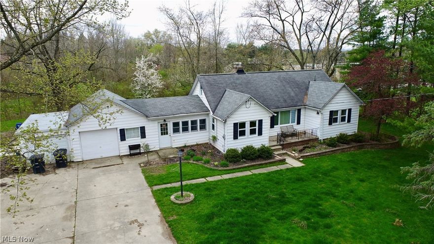 Here's the one that you can call home for years to come. This home sits on a total of 4 lots to equal more than half an acre. This 2 bedroom home is ready for your vision and updates to bring it back to its splendor. Built-ins in the dining room and a huge living room with gas fireplace definitely give you added character. Original hardwoods in the bedrooms are in great shape. With all the outdoor space here, you can be the envy of the neighborhood once you put your sweat equity in on this yard and flowerbeds.  Don't wait too long. The potential here is amazing. Selling as-is.