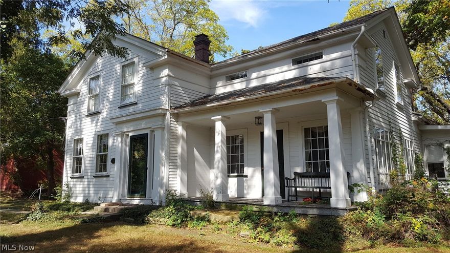As you enter this century home, you will appreciate the beauty and elegance of one of Summit County's historical gems. From the architectural design and detail, the large red barn, and engraved entrance stone of one of this home's first occupants, this house welcomes you from the past. The wide plank, wood floors have been lovingly restored in the kitchen, formal dining room, hall, and entrance foyer. The kitchen has been remodeled with newer cabinets, farmer sink, granite counter tops and stainless steel appliances. The spacious living room has floor to ceiling windows that bring in plenty of natural light, and a beautiful fireplace that can warm a winter's evening. The family room features a utility bar, built in cabinets and book shelves for an abundance of storage. The sun room, right off the family room, is a lovely three season retreat. As you climb the stair to the second floor, you will admire the beautifully crafted hand railing. The three bedrooms are ample sized and are situ