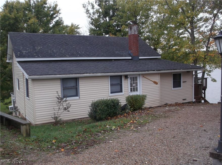 Here is your chance to own a SENECA LAKE WATERFRONT home on PRIVATE PROPERTY!  This 2-3 bedroom, 1 1/2 bath turnkey lake house has an updated kitchen and dining area with bamboo-like laminate flooring.  The living room offers a beautiful stone fireplace and awesome view of the lake from the picture window or large deck.  Two bedrooms and a remodeled bath with stone flooring complete the first floor. A laundry room, storage room and 1/2 bath are located on the basement level along with a water view from the sunroom with fireplace that is currently being used as a 3rd bedroom.  Amenities include a community beach/swimming area, private boat slip, association activity area, and trash service all for only $149/yr!  There's an extra lot for parking, newer septic system (2006), new propane furnace/AC (2014), and new vinyl siding in 2016.  All furnishings including patio furniture to stay, except master bedroom suite.  No MWCD fees, except boat sticker. Don't miss this opportunity, and schedu