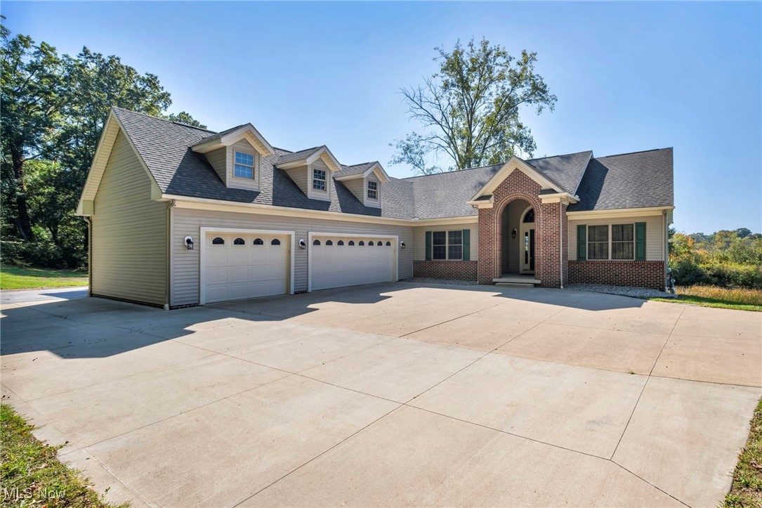 Welcome to your lakeside escape! Nestled on a scenic 1.5-acre lot along the tranquil Long Lake Channel in the highly desirable Portage Lakes area, this beautifully maintained 3,528 square-foot ranch home offers the perfect blend of comfort, functionality, and waterfront charm. Step inside to an inviting open-concept main floor featuring an eat-in kitchen that flows seamlessly into the living and dining areas—perfect for entertaining or quiet evenings at home. Enjoy your morning coffee or evening sunsets on the elevated deck just off the kitchen, offering peaceful views of the channel and surrounding nature.The main level boasts 3 bedrooms and 2 full bathrooms, including a generous primary suite. Downstairs, the fully finished walk-out basement is an entertainer’s dream with a custom wet bar, theatre screen, 2 additional bedrooms, a third full bathroom, and a bonus room ideal for storage, a home gym, or a craft space. The lower-level patio provides another great spot to relax or host guests with easy access to the water. Additional features include a bonus patio off the garage, perfect for grilling or outdoor dining, and a sprawling yard with endless possibilities—whether you’re thinking gardens, a fire pit, or space to launch your kayak. Whether you're looking for year-round living or a weekend getaway, this property delivers the best of Portage Lakes living with direct water access, spacious living areas, and thoughtful outdoor spaces. Don’t miss your chance to own this rare gem on Long Lake Channel—schedule your private showing today!