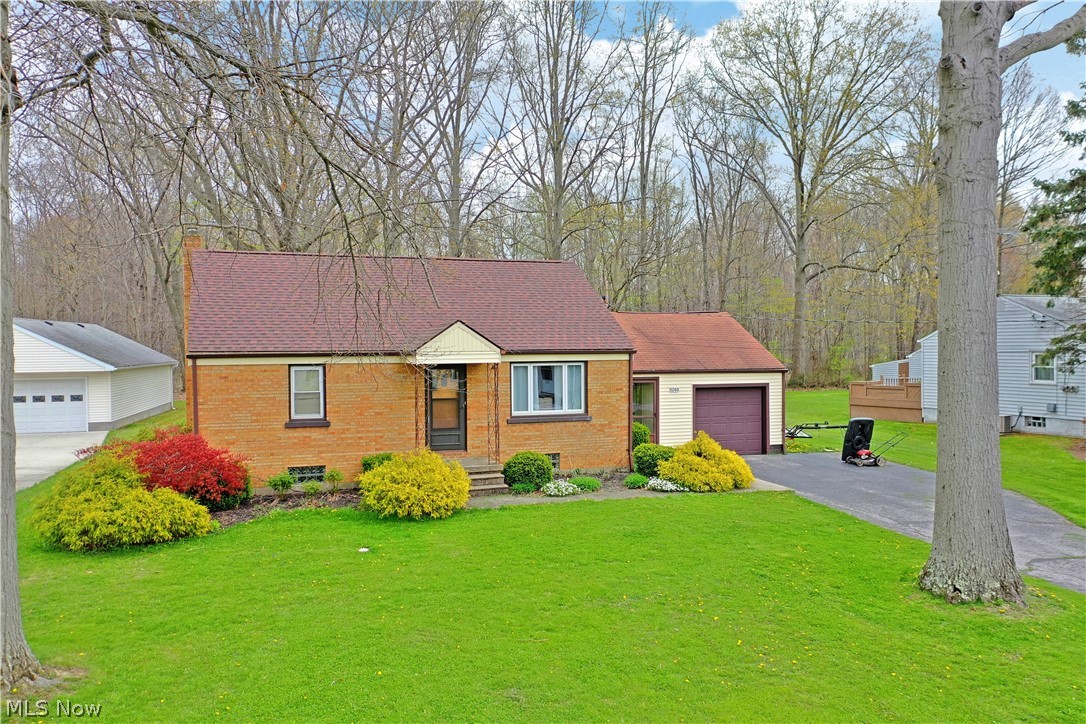 Welcome home to this cozy Champion cape cod! Offering a delightful three-bedroom layout with two full baths plus a bonus room downstairs, you’ll want to quickly make this residence your own. The delightful property offers plenty of curb appeal as the full brick façade stands out with its covered entry way and colorful landscaping. A relaxing breezeway bridges the attached single car garage while around back, a huge dry deck provides a perfect atmosphere to take in warm summer days or enjoy the scenic wooded backdrop. Inside you’re first greeted with a robust living room. Carpeted flooring presides over hardwoods below. A sculpted archway transitions to casual, eat in dining in the kitchen as stained wood cabinets fill the walls. A pair of colorful first floor bedrooms are separated by a full first floor bath. Carpeted stairs lead up to the third, loft style bedroom and additional storage. Below, laundry services join a second full bath as the bonus living space is found opposite the ha
