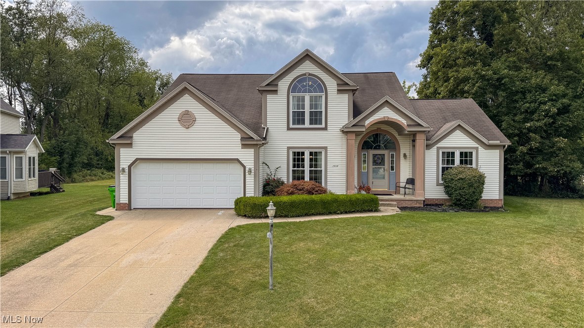 Pride of ownership shines in this stunning one-owner home nestled in the sought-after Kings Mill Development. From the moment you arrive, you'll be captivated by the beautiful curb appeal, mature landscaping, and grand entrance featuring a striking Japanese maple. Step inside to discover an impressive living room with soaring vaulted ceilings, a floor-to-ceiling wood-burning fireplace, and an abundance of natural light. The updated kitchen is a chef’s delight, showcasing stainless steel appliances, stylish granite countertops, and both an eat-in dining space and a formal dining room—perfect for entertaining. The first-floor master suite offers a peaceful retreat with a spa-like soaking tub, double vanity, and walk-in closet. Upstairs, you'll find three spacious bedrooms, a full bath, and new flooring in two of the rooms. Enjoy practical touches throughout, including first-floor laundry, two large hall closets, and Nature Stone flooring in the attached 2-car garage. The new windows throughout fold in for easy cleaning, and a sliding glass door with built-in blinds opens to a lovely back deck, ideal for relaxing or hosting guests. Need more space? The partially finished basement provides additional living or storage options. With a newer HVAC system and hot water tank, you’ll have peace of mind for years to come. Schedule your private showing today and make this exceptional home yours!