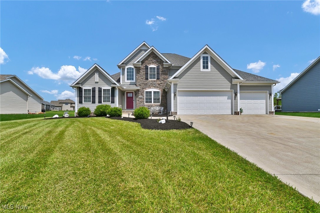 Thinking of building? Think again! This "like new" home offers all of the conveniences of new construction at a fraction of the cost! Built in 2018, this highly desirable 2 story offers main level living with an appealing floor plan. At nearly 3000 square feet of living space, you'll find a bright, open first level that welcomes you with a 2 story great room featuring an upgraded floor to ceiling stone fireplace, a chef's dream kitchen with stainless steel appliances, granite countertops and a huge center island/breakfast bar, a spacious first floor Owner's suite with 2 walk in closets, a fantastic office or additional dining area, laundry room and half bath. All on the main level! The upper level includes 2 generous bedrooms, full bath with separate sink rooms, and a large, open loft area perfect for a game room, play room, study area, etc. The lower level offers tons of storage space plus a finished area that includes a sink ideal for a craft room, work shop etc. So much to offer in an amazing location! Don't miss out on this one!