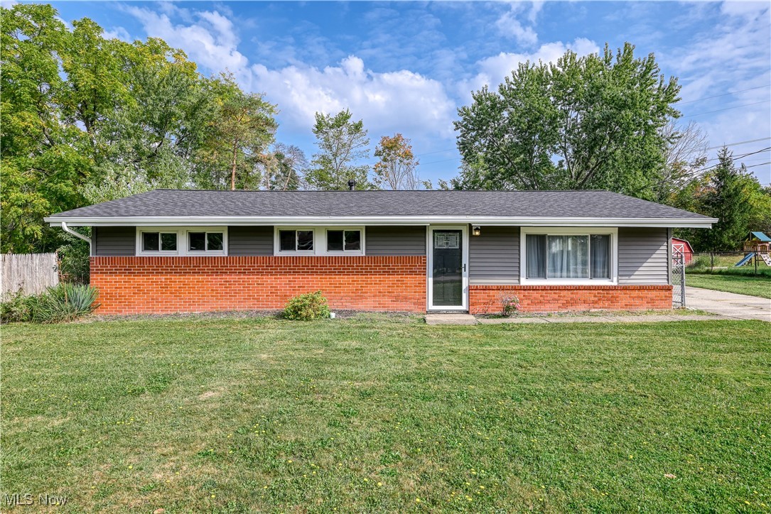Recently renovated ranch with 3 bedrooms, 1 full bath and an oversized detached 3 car garage. Neutral finishes from paint to flooring. Not much to do, but move-in! The front door welcomes you to a small foyer with coat closet and then into the large living room, directly into the dining area and kitchen with all LVT throughout. Recessed lighting has been added to really brighten up the spaces. The large kitchen is fully applianced with ample cupboards and countertop space. Through the kitchen you will find the laundry room with an option for folding or possibly a coffee bar and a utility sink. The washer and dryer will also stay for the new homeowner. Down the hall you have all three bedrooms and 1 full bath and linen closet. Full attic with pull down stairs. The detached 3 car garage has two garage door openers and a side entrance. Yard is fully fenced with a gate that closes across the driveway. Updates to include roof on the house & garage 2024, furnace moved to attic in 2023, AC 2023, siding, soffit and gutters 2023, windows 2024, front and back door 2023, all electrical 2023, kitchen and appliances 2023, barn style closet doors 2023, recessed lighting 2023, LVT 2023.