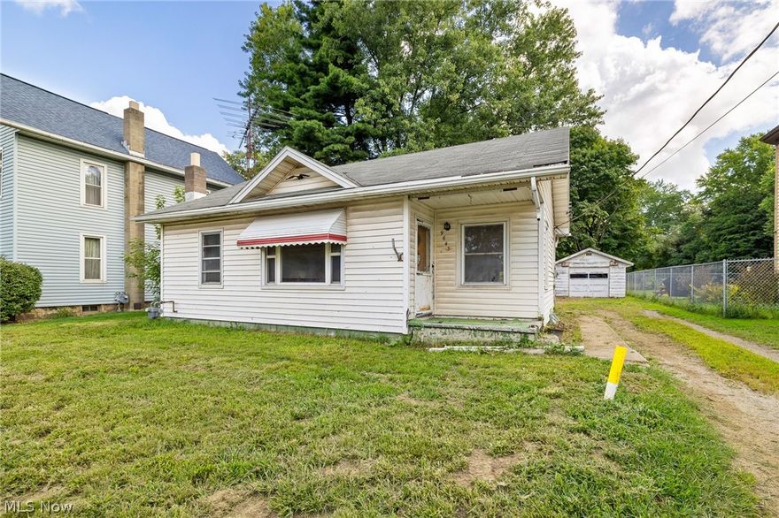 As-Is two bedroom ranch home with open concept kitchen and dining room. Plenty on natural light throughout the home. Country setting with a garage and an outbuilding.