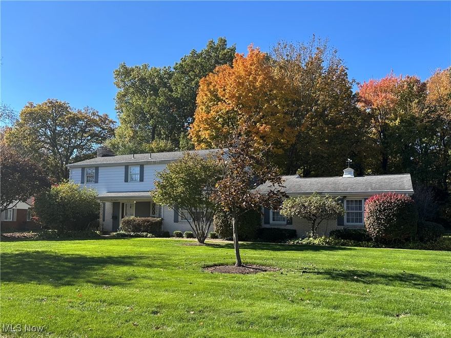 Experience the epitome of classic elegance in this stately colonial home, offering over 2,800 square feet of tasteful living space. Nestled on a generous half-acre lot, this residence boasts a picturesque backdrop of Stevens Park, surrounded by mature trees that provide both beauty and privacy. The home is situated in a sought-after Niles neighborhood, characterized by lovely homes and a welcoming atmosphere. Step inside to discover spacious, sun-drenched rooms adorned with timeless details such as crown molding, pocket doors, and hardwood flooring. The first floor features a formal living room with a cozy wood-burning fireplace, an elegant dining room, and a versatile den/study. The fully equipped eat-in kitchen is a chef's dream, offering an abundance of counter space and cabinetry for all your culinary needs. Additional highlights include a large laundry room, a wood-paneled family room complete with a fireplace and bookshelves, and a convenient half-bath. Ascend to the second floor, where you will find a wonderful primary suite that includes a walk-in closet and an attached bath, providing a private retreat after a long day. Three additional generously sized bedrooms and a full bath ensure ample space for family and guests. The hallway features a large walk-in storage closet and a linen closet, further enhancing the home's impressive storage capabilities. With a full basement and an attached two-car garage, practicality meets comfort in every corner of this residence. Step outside to the backyard, where a charming brick patio invites you to unwind amidst lush greenspace. For those who enjoy an active lifestyle, Stevens Park is just a stone's throw away, perfect for a game of pickleball or tennis. This home is not just a place to live; it is a sanctuary that combines comfort, style and convenience in one remarkable package.