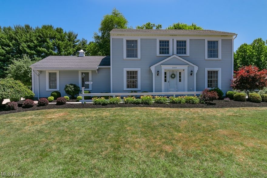Situated in a lovely neighborhood, the almost 3000 square-foot colonial has been completley updated and is ready for today's discriminating buyers. Top-of-the-line materials and supert craftsmanship complete this renovation. The kitchen was updated to include quartz countertops, soft-close cabinetry, under-counter lighting, beautiful glass backsplash, and LE Halo lighting. Commercial-grade luxury vinyl plank flooring was installed in several rooms. The entire interior of the home has been freshly painted, including the trim. Bathrooms were remodeled with new toilets, vanities, and fixtures. The master bath has a new shower insert with custom glass doors, vanity, and high-end fixtures. The family room features a wood-burning stove and built-in bookshelves. The dining room has custom wainscoting and is ideal for hosting your holiday dinners. The sunroom has vaulted ceilings that can be used year-round! A large finished basement can serve as a possible 5th bedroom or office. There is a huge additional heated 3+ car garage/workshop that includes a 220v air compressor, and plenty of built-in cabinet storage. The house has dual-zone heating/cooling and a high-efficiency water heater.