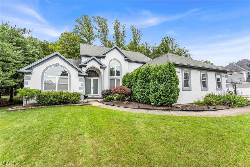 You are going to fall in love with this gorgeous home in Macedonia! A striking home with beautiful curb appeal featuring eye-catching white & gray exterior, landscaped garden beds, sweeping walkway & arched entrance! Step inside to a large foyer with beautiful vaulted ceilings & 2-story windows that's filled with natural light! The main floor features plenty of living space, including a dining room, sitting room, family room with fireplace & space for play area & home office- each room distinct & unique! The incredible kitchen is a chef's dream & features gorgeous wrap-around cabinetry for an amazing amount of storage, large island, morning room for casual dining & rear extension lined with windows, skylights & double glass doors leading to the rear deck! Laundry area & a half bath the main floor. Plus a huge master bedroom with vaulted ceilings, skylight & jacuzzi conveniently located on the main floor as well! Upstairs are 3 additional bedrooms, one with an ensuite full bath, as well