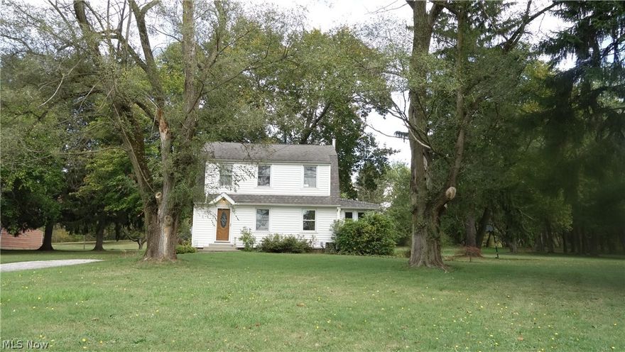 *WOW over 3 ACRES* of nature's paradise!!  A very large, open kitchen with an island that is perfect for casual dining, prep work, etc., plus plenty of oak cupboards & extra's, that all flows into a huge dining area with sliders & a fantastic back yard view and jumbo deck, that is private from a busy world!!  Truly beautiful oak flooring throughout the kitchen, dining area, living room and foyer entrance!  And  "yes" this home could be yours with immediate possession at close!   Vinyl windows and multiple updates throughout! Words cannot describe how wonderful this back yard is, with over 3 acres of privacy--see attached lot drawing!! Located in Coventry Twp. and Coventry LSD w/a Barberton zip code. Just minutes to Portage Lakes State Park with public boat launch (see pictures).