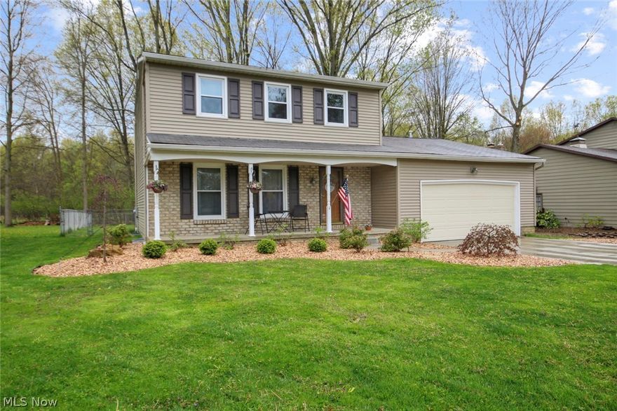WOW! Just move right into this updated home with modern amenities. Freshly painted 3 Bedroom 2.5 Bath with formal living room, formal dining room and eat-in kitchen with granite countertops. Home backs into woods with privacy plus fenced backyard and patio. New landscaping with stone around entire home. Kitchen updates include: pendant lights, LED can lights, LED lights above and below cabinets, white cabinetry with soft close doors and drawers, granite countertops, sink, faucet and stainless steel appliances. Spacious Family room adjoins kitchen with wood burning fireplace, custom maple mantel and custom hardwood cabinets accented with ship lap above cabinets. Guest 1/2 bath has updated vanity, mirror, toilet and porcelain floor. First floor updated with Pewter laminate flooring, 4" hardwood baseboards, hardwood door casings and 6 panel doors. Second Floor has newer carpet and 6 panel doors. Basement has New Full bath with new water-proof resistant flooring, 2 new storage rooms, repla