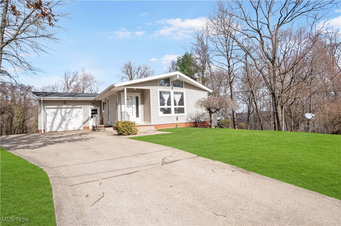 One-of-a-kind Lake Mohawk home, ready for its new owners! You will be amazed at the double living space on the main and lower levels. With full kitchens on both floors! The main floor is open with vaulted ceilings, updated kitchen, separate living suite, and inviting 3-tier deck with outdoor space for entertaining. The lower level large family room, Kitchen, master bedroom, bathroom, and surrounding space have been updated. The lower level has a separate living room with a fireplace and walkout sliding glass doors. The laundry room is on the lower level, with storage and flexspace (currently used as a bedroom). This home is like having two homes in one! If you have been looking for extra space for other family members, you have to see this property. If you love lake life and being able to spend time boating, hanging out at one of the two beaches, pickleball, or tennis, then this private gated community is waiting for you. Motivated Sellers.