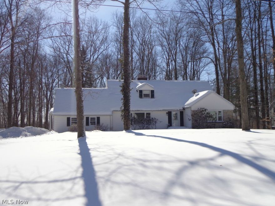 Looking for a gorgeous Solon home with character, updates, privacy and space in a fabulous lake community development? Look no further! Welcome to this 4 bedroom Cape Cod on a dead end street in sought after Briar Hill! Hardwood floors run throughout most of the home, including under carpet on second floor. NEW (August 2014) CARPET in GREAT Rm and ALL BEDROOMS! Beautifully updated kitchen (2011) with granite, maple cabinets, S/S appliances including double wall oven, and door to sprawling deck overlooking the park-like wooded back yard! Great bedroom sizes including 17x13 master, updated bathrooms, fresh paint throughout much of the home, and California closet systems in 3 bedrooms. Energy audit performed this winter and all recommendations were completed, including insulation improving the home efficiency by over 1000 cfm. Many bells and whistles including low voltage exterior lighting, whole house natural gas generator, NEST thermostat system, and chilled & filtered built-in soda wat