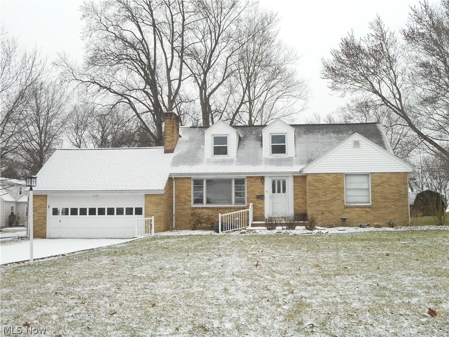 Charming brick cape cod featuring hardwood floors, cove ceilings, living room with wood burning fireplace, sunny dining room with built-in hutch, 2 bedrooms & updated full bath on the 1st floor, dormitory style bedroom up with separate 5 x 15 area with loads of built-in storage and an updated half bath, newer laminate floor in the kitchen with appliances, basement with rec room, knotty pine dry bar, glass block windows and half bath, covered patio, shed and more! Seller is furnishing a one year home warranty. Great location.  Call now for your private showing!