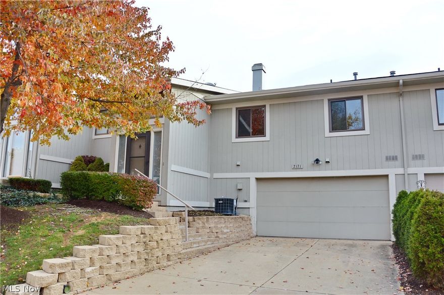 Desirable Lockwood Ridge condo - Spacious and open floor plan in this updated 2 bedroom, 1.5 bath unit. It features an attached 2 car garage, living and dining room with vaulted ceilings, spacious lower level family room with stone fireplace and beamed ceiling. Large master bedroom with walk-in closet, eat-in kitchen with tile back splash with open concept to view living and dining areas. The bathrooms have been updated, windows replaced and the building has a newer roof and siding. Many amenities in the community include: a party center, large pool, playground, tennis and basketball courts, and pond. Conveniently located to highway access.