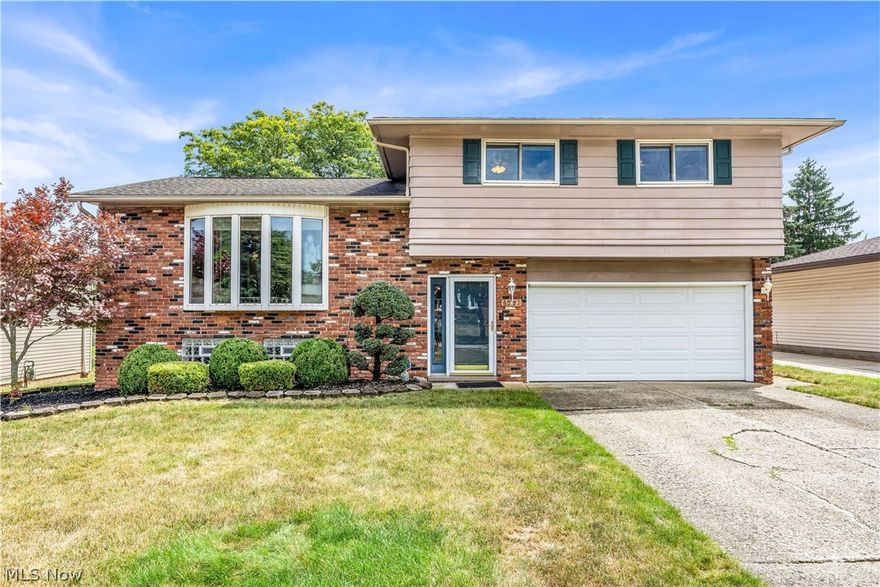 Meticulously maintained...thoughtfully updated...lovingly cared for...just a few of the sentiments you'll take away with you after touring this 3 bed/1.5 bathroom split level home situated on a cul-de-sac street in a coveted Bedford Heights neighborhood. The long-time owners have spared no expense over the years including custom crown molding and updates around every corner...Gorgeous and preserved hardwood floors cover the formal living area and dining room, illuminated from the natural sunlight pouring in through the front bay window. Updated kitchen w/ stainless steel appliances, ceramic tile flooring, and solid wood cabinetry. Rare back living area w/ sliding glass doors overlooking and leading out to your freshly painted back deck. Upper level full bathroom updated with beautiful tile work, shower/tub combo, and chic vanity. Each of the bedrooms located on the upper level are spacious and include generously sized closets. Finished lower level provides a private, additional living space. Adjacent to the lower level living area is a fabulous laundry room complete with cabinets and sink. The large quarter acre lot provides a sanctuary that is hard to come by in the suburbs. HVAC replaced in April 2020. If you are in the market to purchase a home that has been loved on for decades...this is the one! Don't take our word for it - schedule a showing and come see for yourself!