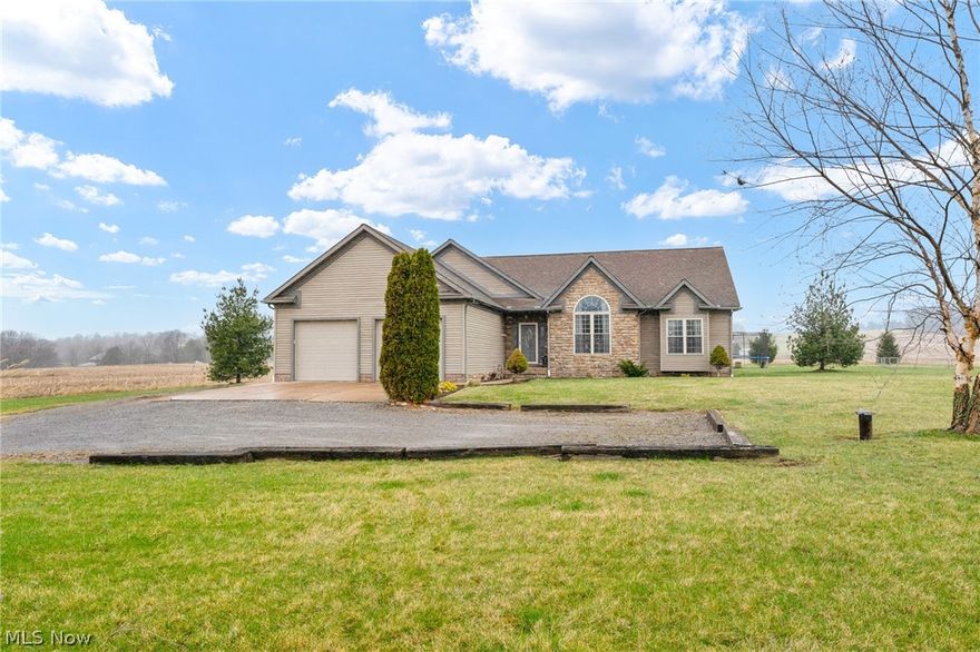 Awesome Custom Built Ranch Home in Minerva Schools. This beautiful home is filled with quality workmanship and details. You will love the OPEN FLOORPLAN and the spectacular views of the Countryside...your own field of dreams! The main floor offers a huge great room with Cathedral ceilings and updated ceiling fans. Wide open to kitchen with an amazing island bar perfect for entertaining. The kitchen has quality custom maple cabinetry and solid surface countertops, stainless appliances and skylights. Kitchen is open to large dining area overlooking the beautiful backyard. The First Floor Laundry is amazing with an abundance of counters and storage. There are 3 bedrooms on the first floor with the master featuring a large ensuite bath with Jacuzzi Tub and walk in closet. A nice hall bath with tub. The lower level is an entertainers dream. Huge Finished Rec Room with storage closets galore. There is also a 4th Bedroom and full bath on the lower level and several storage rooms. The living s