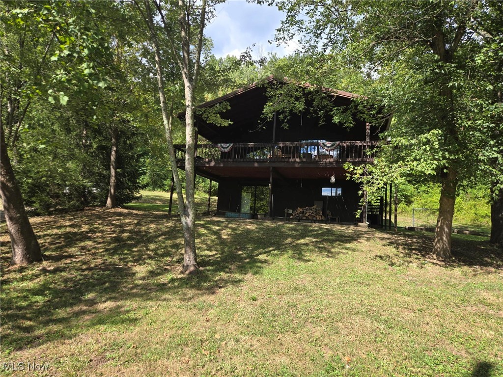 Escape to your own private retreat nestled in the hills of McConnelsville, Ohio! This charming, wood-sided home offers a peaceful, scenic escape with breathtaking views of the Muskingum River. Imagine sipping your morning coffee on the spacious 2-story deck or hosting a barbeque on the patio, all while soaking in the beauty of the surrounding woods and the tranquil river below. With 3 bedrooms & 2 full baths, this home is perfect for a full-time residence or lucrative Airbnb rental. The home features a 1 car garage and a full finished basement, providing ample space for storage, a home gym or a cozy entertainment area. With river frontage included, you'll have direct access to fishing, kayaking & boating. This unique property offers the best of both worlds: a secluded, natural setting with the convenience of being just minutes from the amenities of both McConnelsville & Zanesville. Don't miss the chance to own this slice of paradise. Contact us today to schedule a showing!