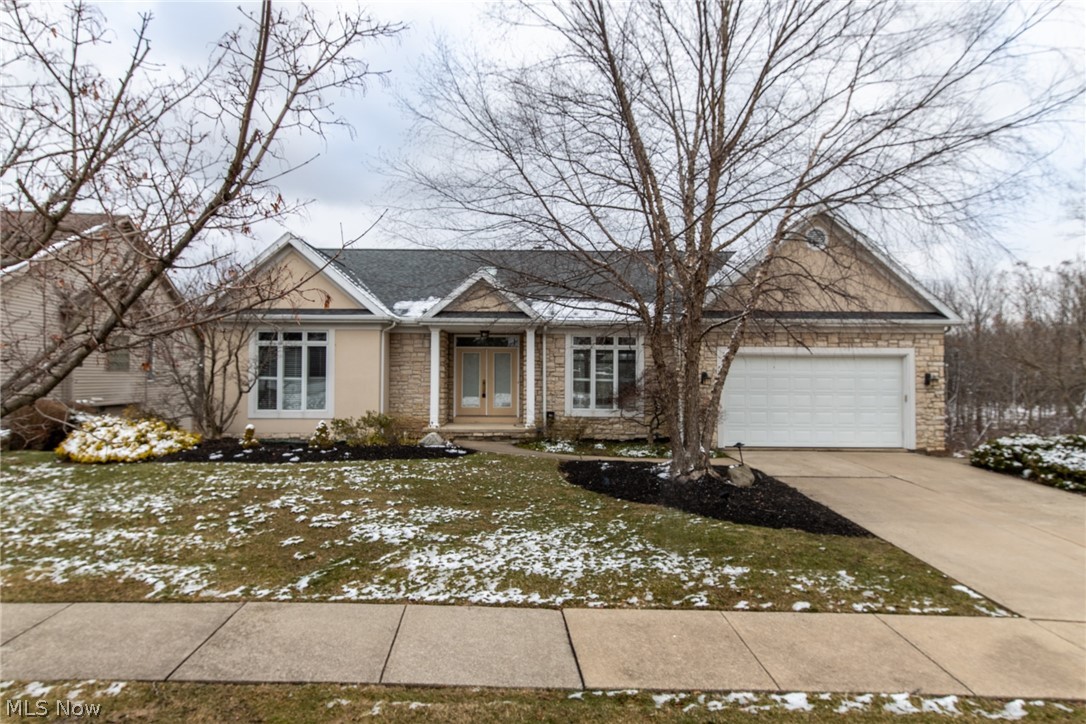 First floor living! Open floor plan! Water view... Finished walk-out basement... Versatile living space... Great Solon location! From the double door entry you will immediately appreciate the open floor plan & custom details. Huge formal dining area opens to the great room with wall of windows & breathtaking views of the pond and the wooded area beyond the pond. Tucked in the front of the home is a room currently used as an office that could certainly be a 2nd first floor bedroom with its private full bathroom. There is a separate laundry room/mudroom and also a half bathroom on the first floor. Owners suite has sliding glass doors leading to balcony overlooking pond... a walk-in closet/dressing room, 2nd closet & spa bathroom with updated tiled shower and separate tub. Gourmet kitchen features granite counter-tops, tiled back-splash and all appliances. The finished lower level has three additional bedrooms, an office or workout room, full bathroom & second family room with sliding